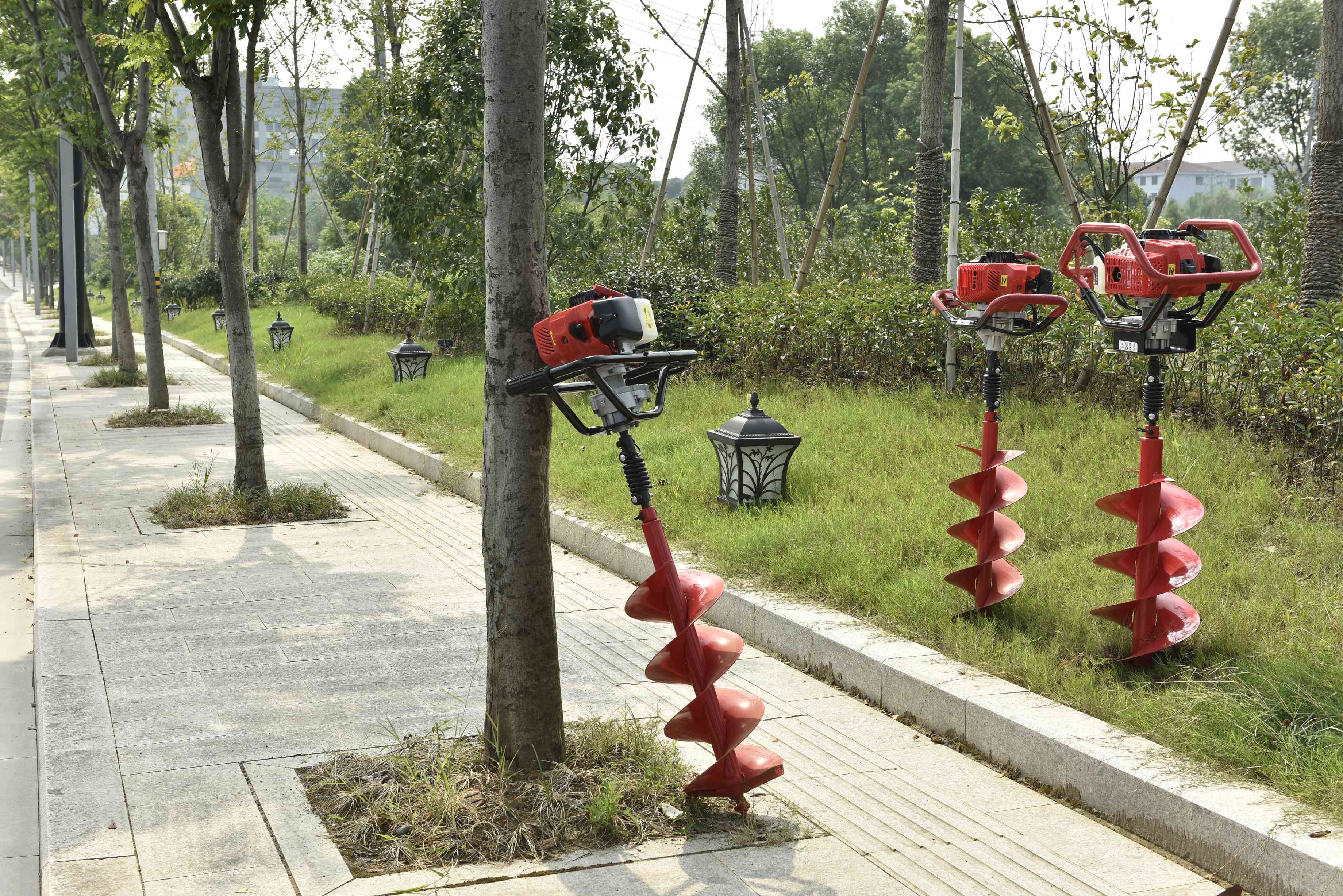 What is the difference between an earth auger and a standard drill